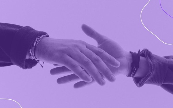 Two people's hands holding with a purple overlay